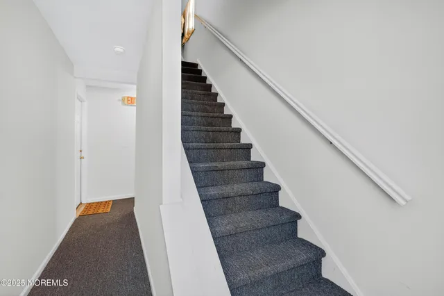 an aerial view of a city with swimming pool and ocean view