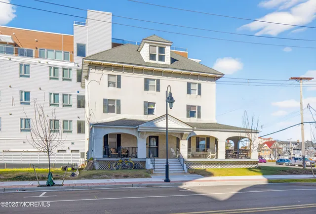 a front view of residential houses with yard