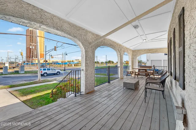 a view of a patio with dining table and chairs