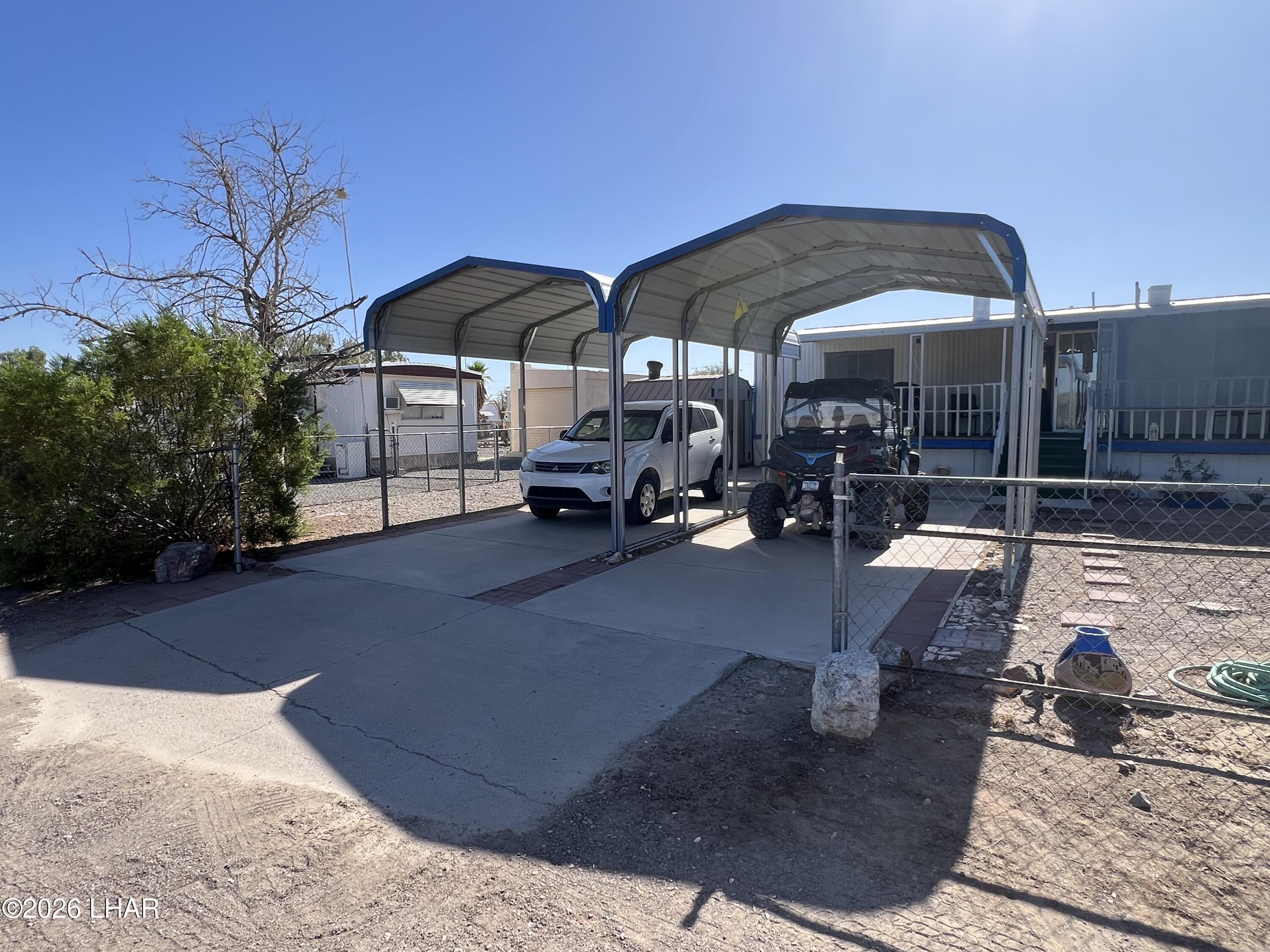 776 Granada Drive Quartzsite, AZ 85346 - Photo 11 of 39 Two HOA permitted carports, 12x20 & 12x16