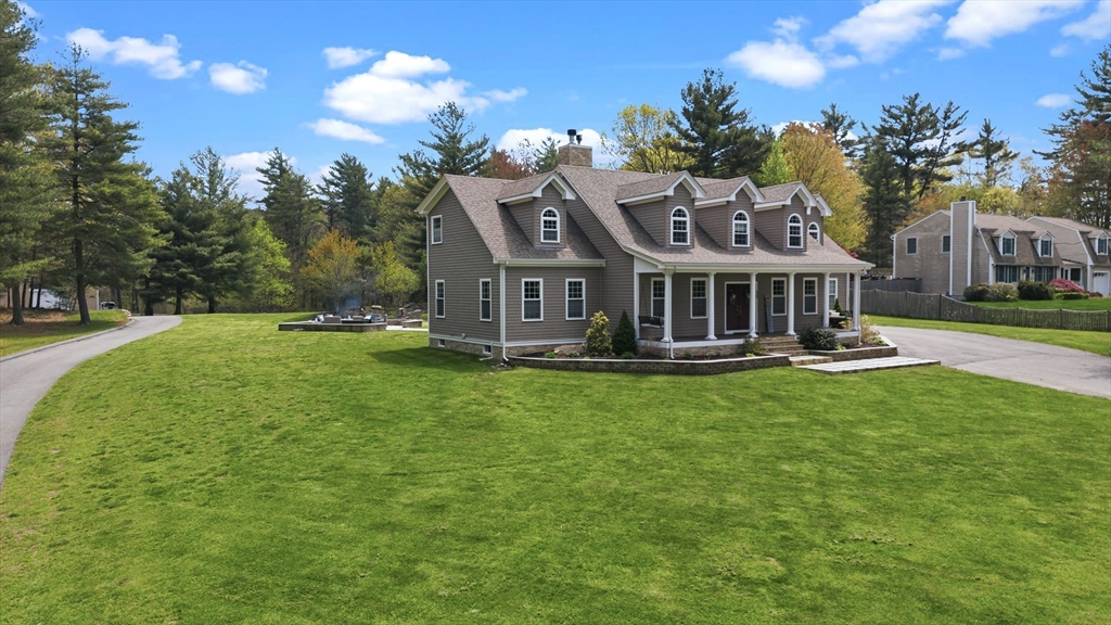 35 High Street Freetown, MA 02702 - Photo 5 of 40 a front view of a house with garden and swimming pool