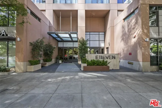 a view of a patio with table and chairs potted plants