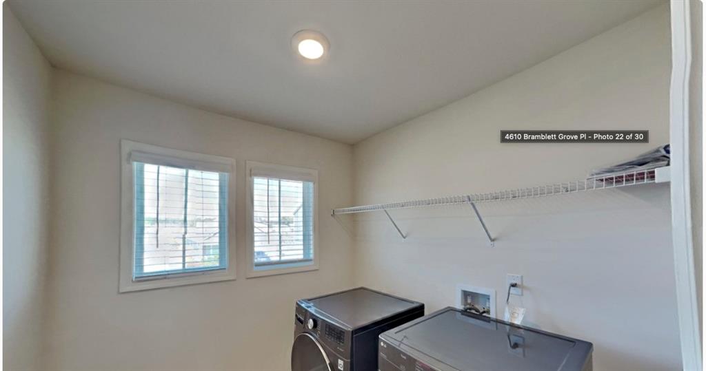 4610 Bramblett Grove Place Cumming, GA 30040 - Photo 13 of 20 a bathroom with a sink a toilet and a mirror