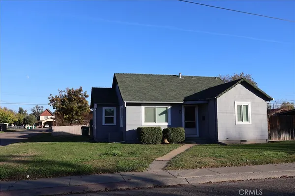 a front view of a house with a yard