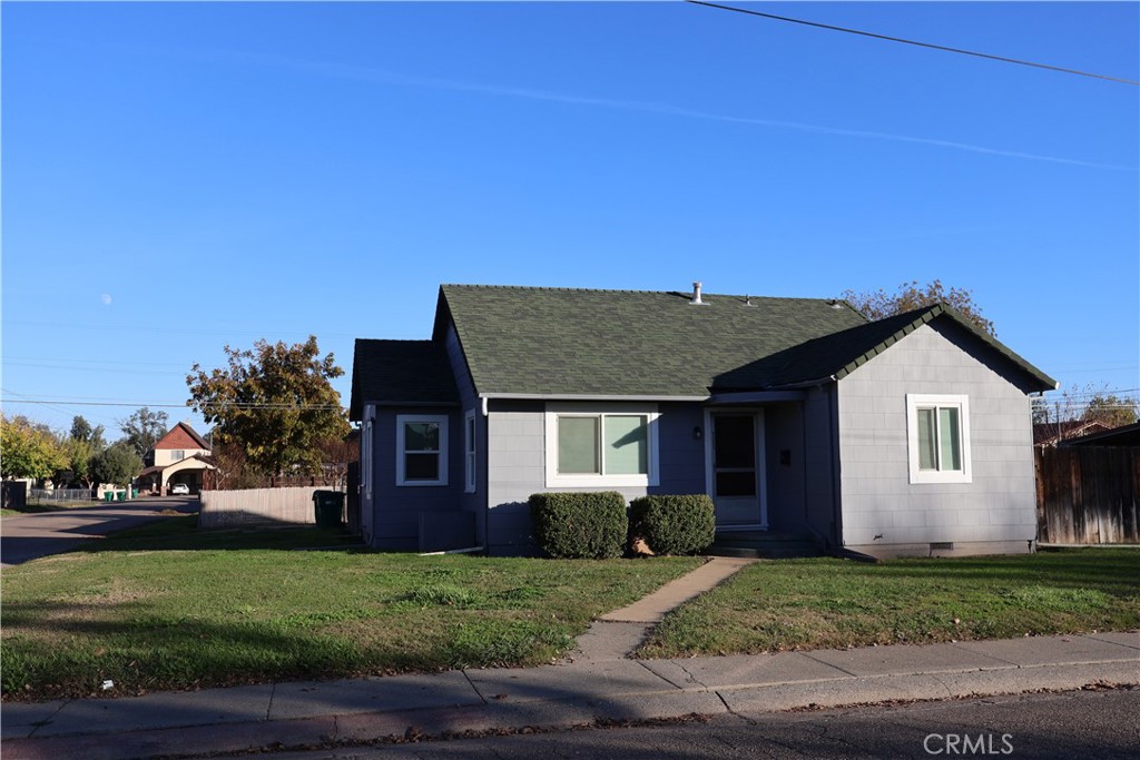 1311 6th Avenue Corning, CA 96021 - Photo 3 of 48 a front view of a house with a yard
