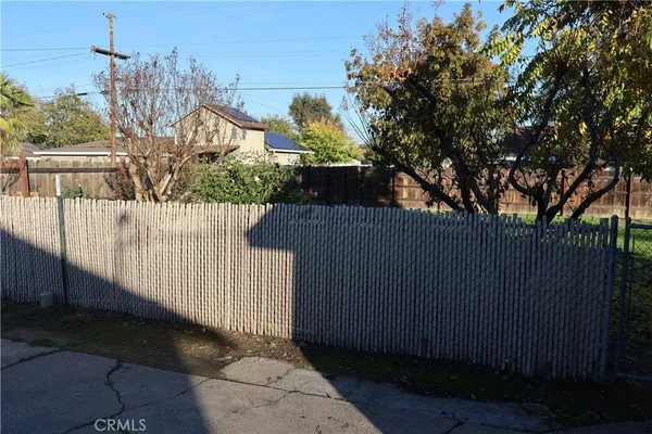 a view of a wrought iron fences in front of house