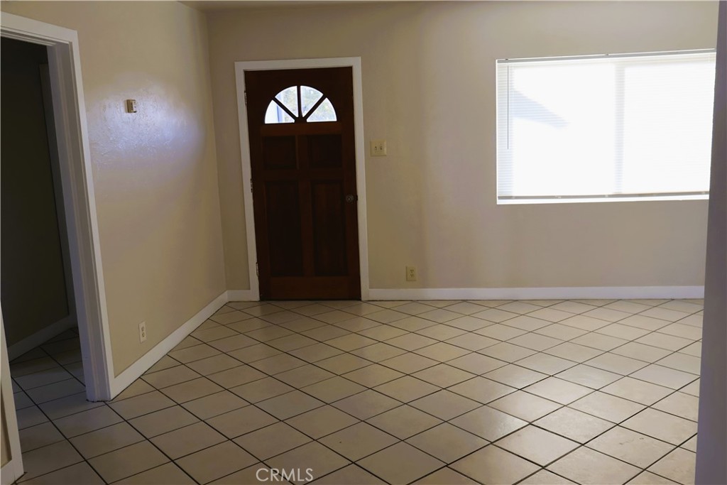 1311 6th Avenue Corning, CA 96021 - Photo 9 of 48 an empty room with wooden door