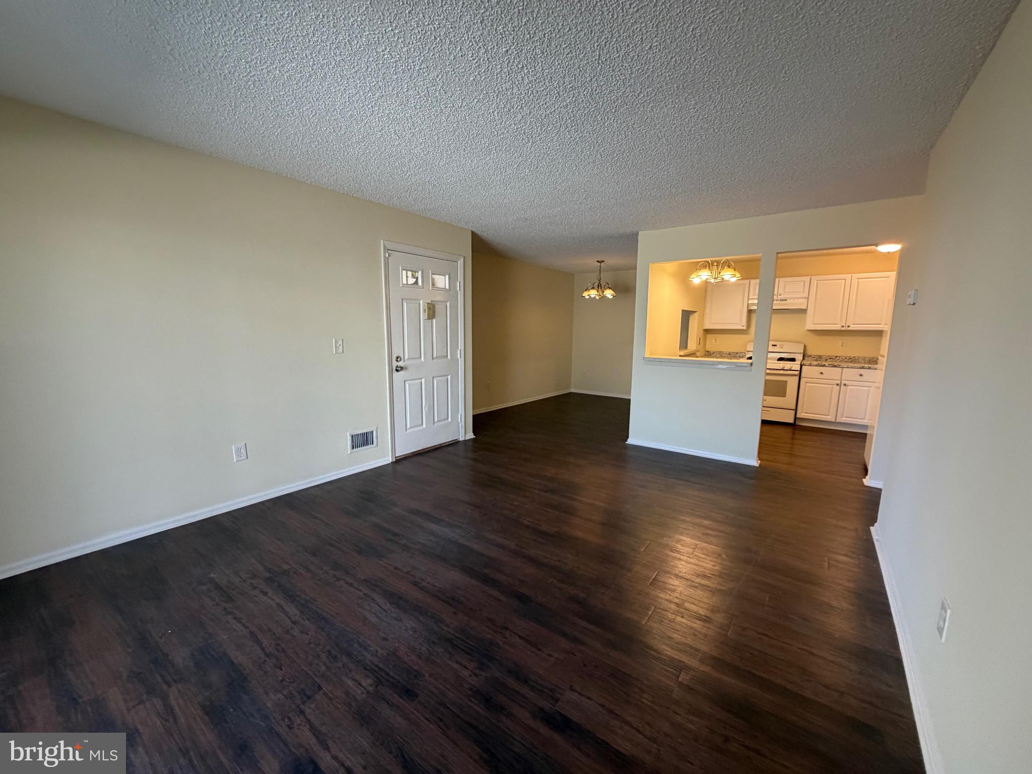 64 Mattix Run Absecon, NJ 08205 - Photo 1 of 14 a view of empty room with wooden floor and windows