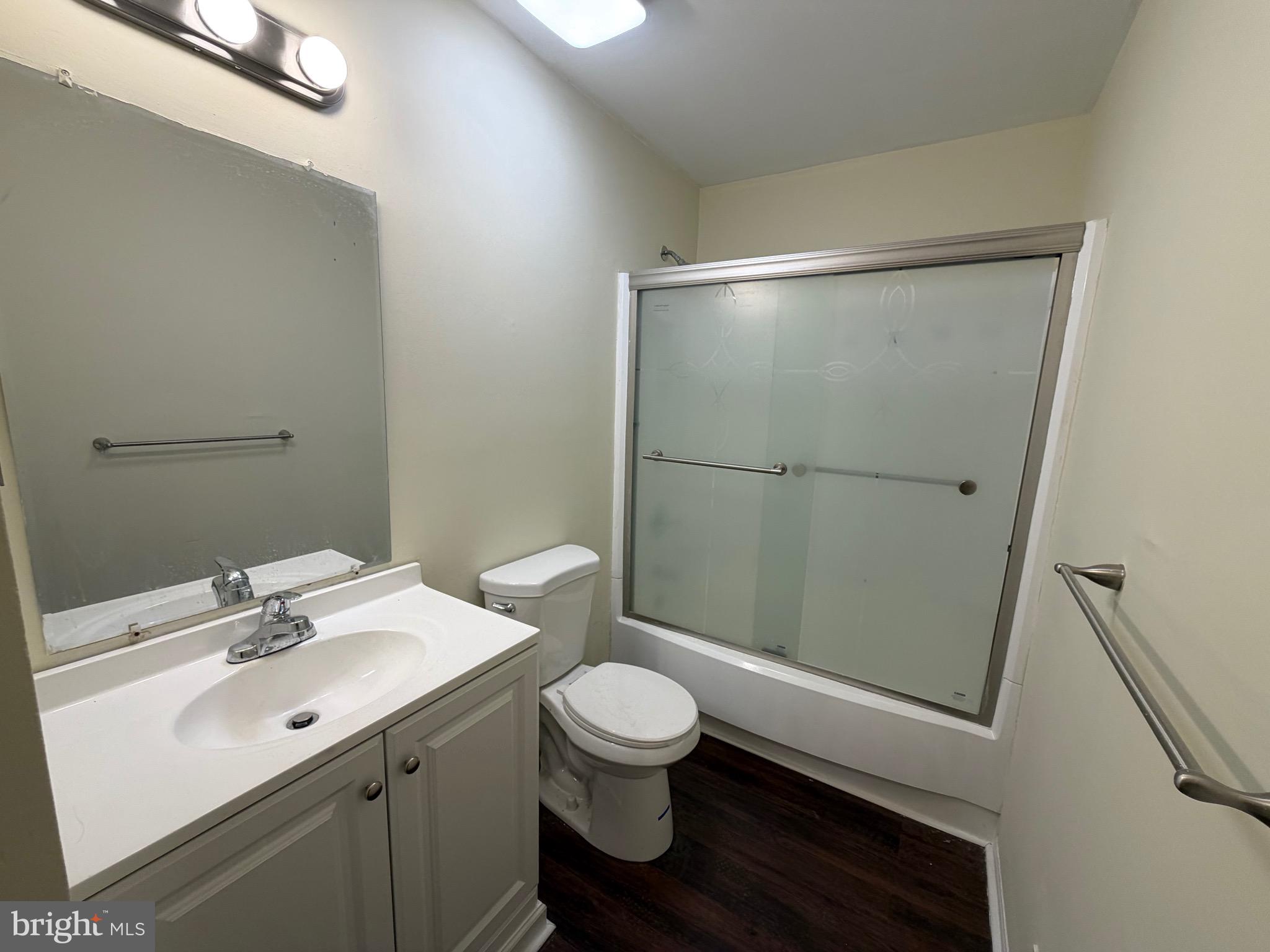 64 Mattix Run Absecon, NJ 08205 - Photo 7 of 14 a bathroom with a sink a toilet a mirror and shower