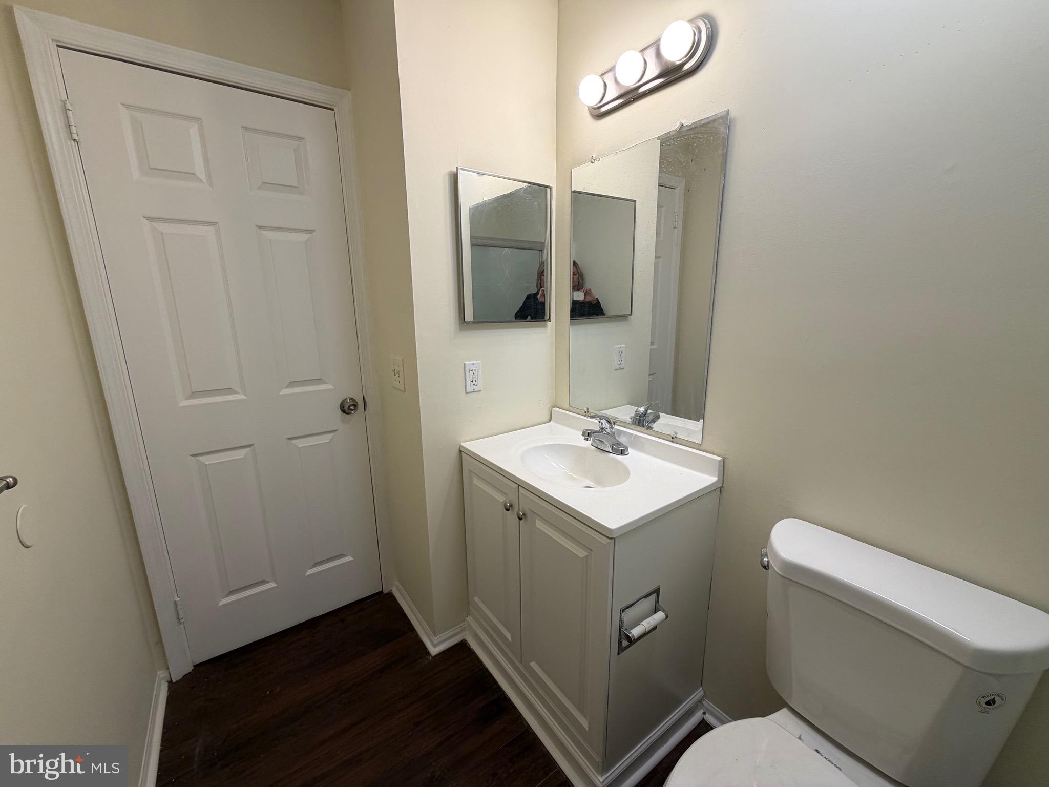 64 Mattix Run Absecon, NJ 08205 - Photo 8 of 14 a bathroom with a sink a toilet and mirror