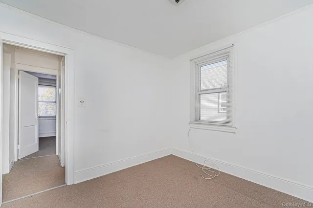 a view of front door with wooden floor