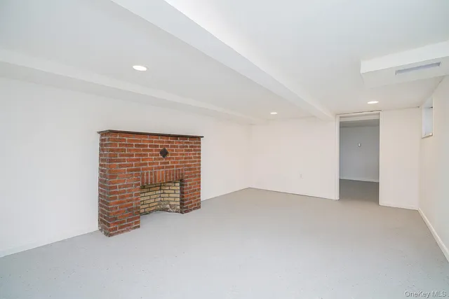 a white toilet sitting next to a shower