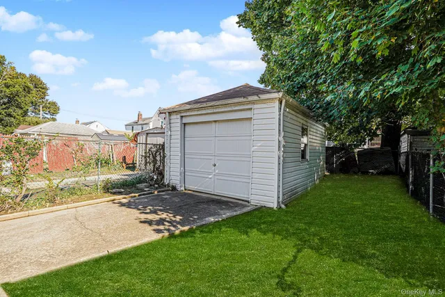 a view of an empty room with wooden floor and closet