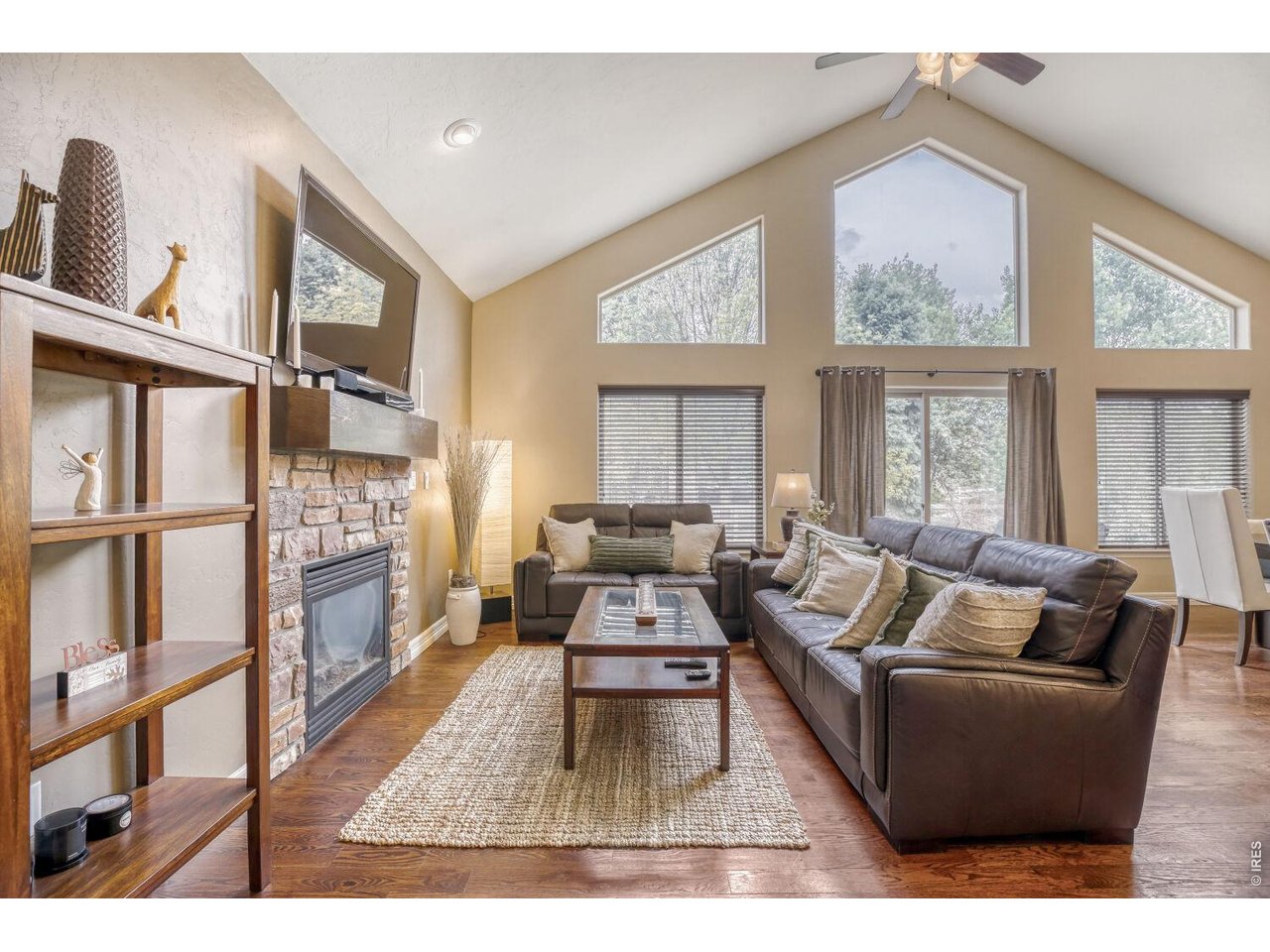 7992 St Street Frederick, CO 80530 - Photo 5 of 28 a living room with furniture wooden floor and a large window