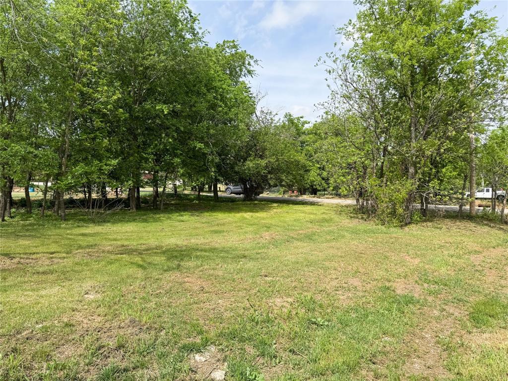 301 West 2nd Street Cisco, TX 76437 - Photo 5 of 9 a view of outdoor space with deck and yard