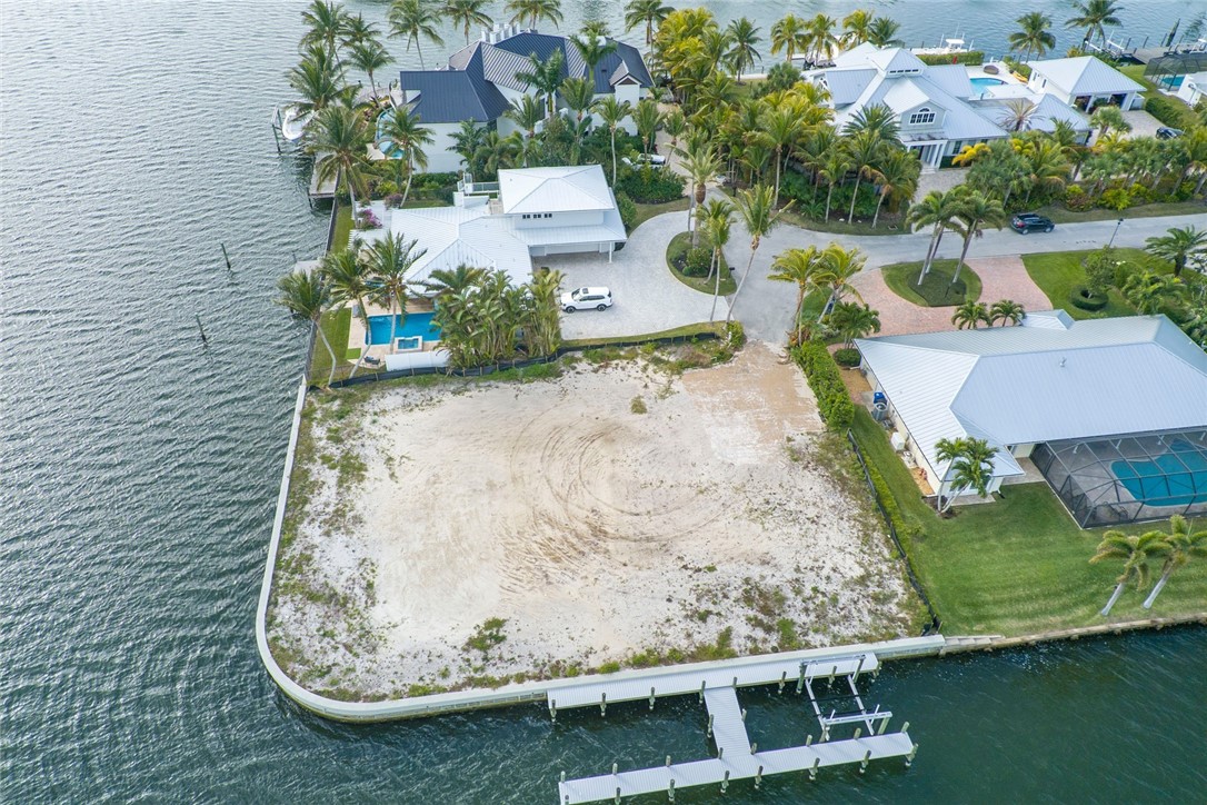 3 Sailfish Road Vero Beach, FL 32960 - Photo 13 of 17 an aerial view of a house with a yard and lake view