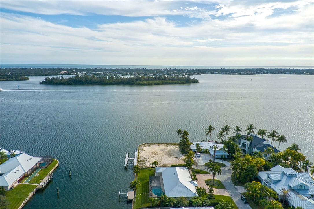 3 Sailfish Road Vero Beach, FL 32960 - Photo 16 of 17 a view of a lake with lawn chairs