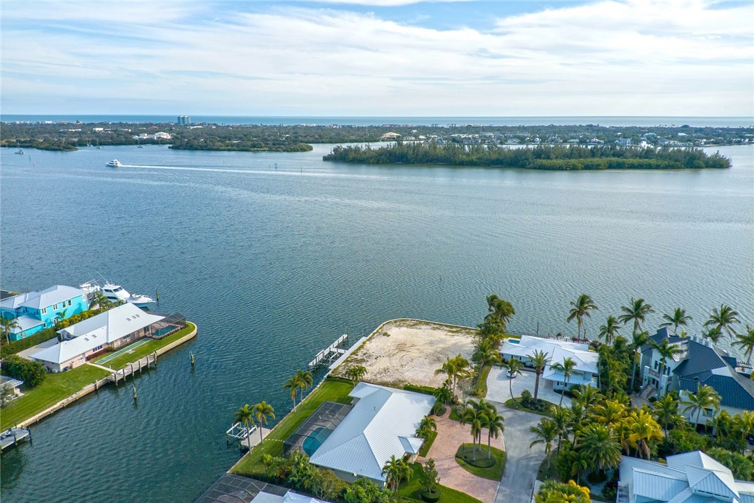 3 Sailfish Road Vero Beach, FL 32960 - Photo 17 of 17 a view of a lake with a table and chairs