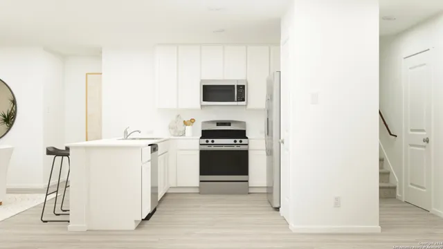 a kitchen with a stove and a refrigerator
