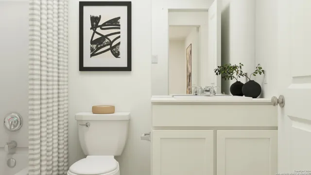 a bathroom with a toilet and a sink