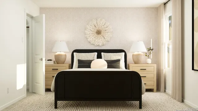 a bed sitting in a bedroom next to a window with a chandelier