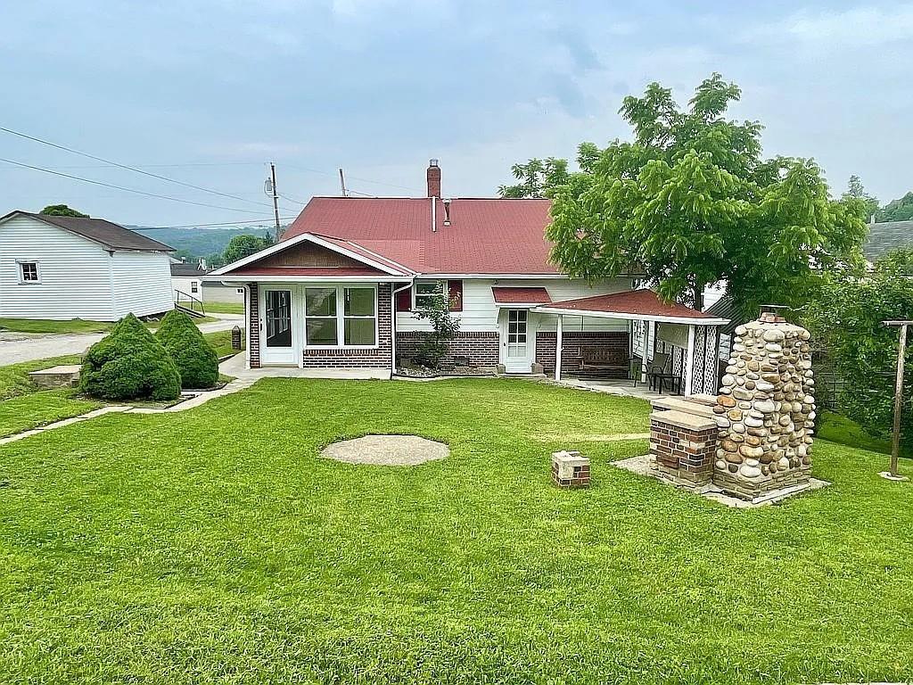 449 Race Street Waynesburg, PA 15370 - Photo 2 of 20 a front view of a house with a yard table and chairs
