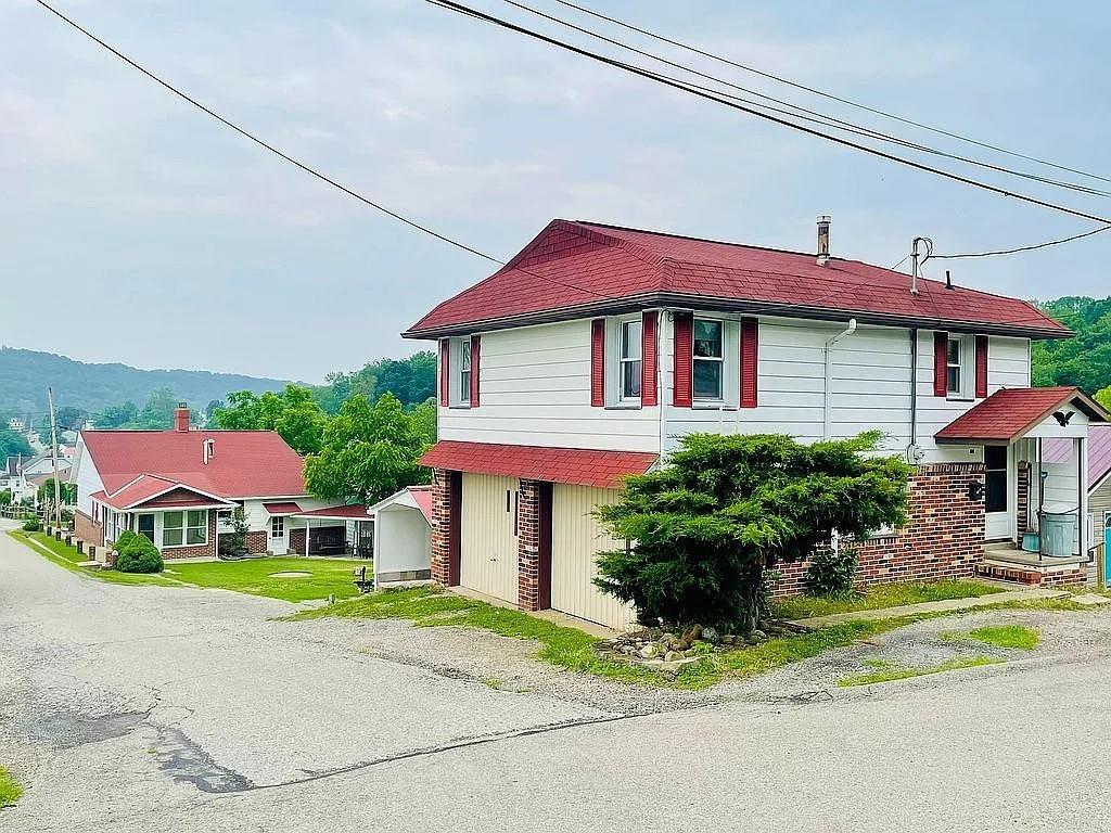 449 Race Street Waynesburg, PA 15370 - Photo 5 of 20 a front view of a house with a yard and porch