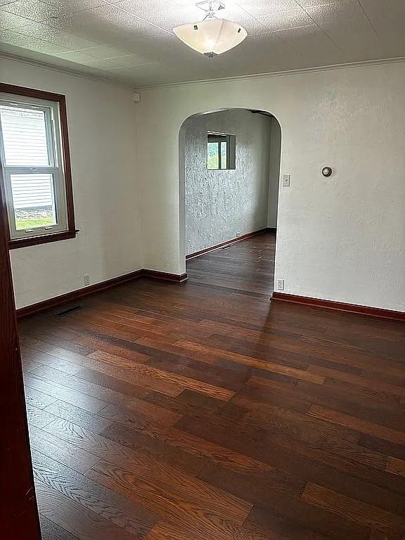 449 Race Street Waynesburg, PA 15370 - Photo 8 of 20 an empty room with wooden floor cabinet and windows