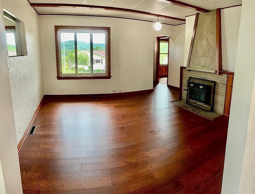 449 Race Street Waynesburg, PA 15370 - Photo 9 of 20 a view of a livingroom with wooden floor and a fireplace