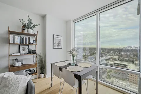 a view of a dining room with furniture window and outside view