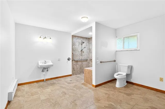 a bathroom with a shower and a toilet
