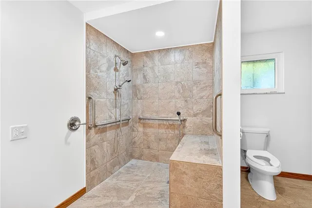 a bedroom with a bed and a black white checkered floor