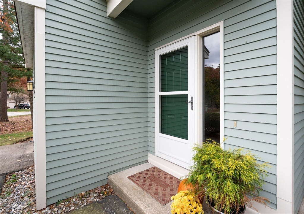 98 Indian Rock Road, Unit 98 Merrimack, NH 03054 - Photo 2 of 40 a view of a door and a window