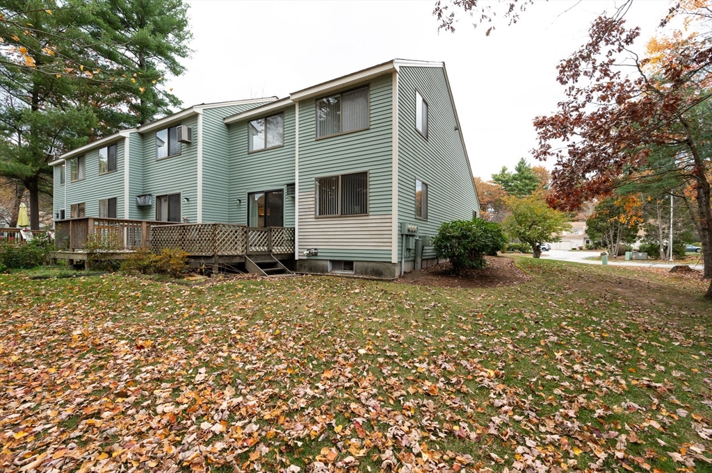 98 Indian Rock Road, Unit 98 Merrimack, NH 03054 - Photo 31 of 40 a view of a house with a yard