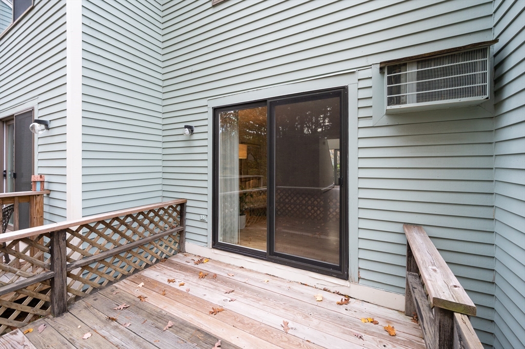 98 Indian Rock Road, Unit 98 Merrimack, NH 03054 - Photo 33 of 40 a view of a house with wooden door
