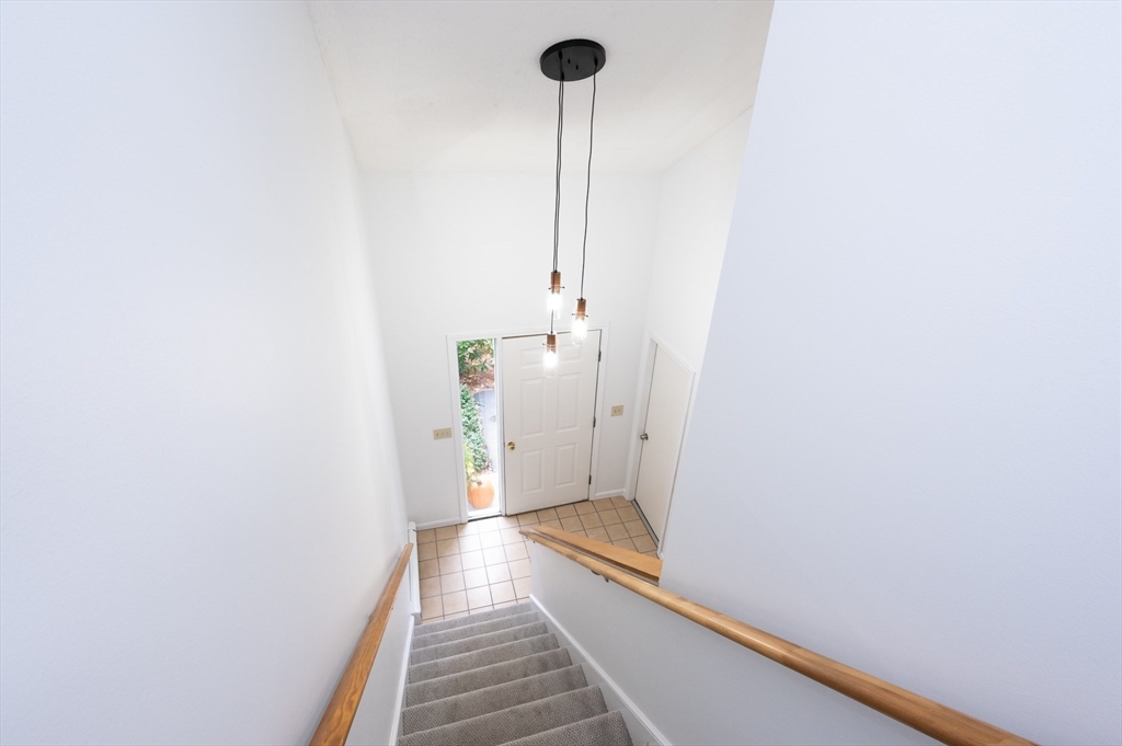 98 Indian Rock Road, Unit 98 Merrimack, NH 03054 - Photo 5 of 40 a view of hallway with wooden floor