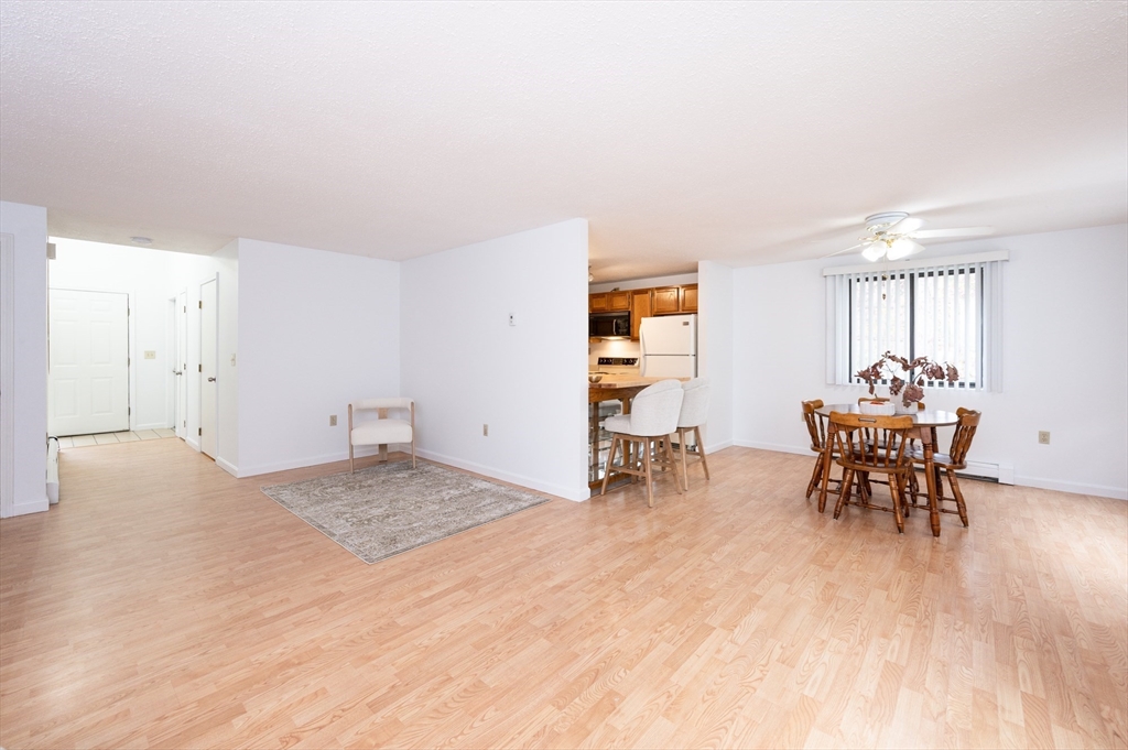 98 Indian Rock Road, Unit 98 Merrimack, NH 03054 - Photo 9 of 40 a view of a work space with furniture and wooden floor