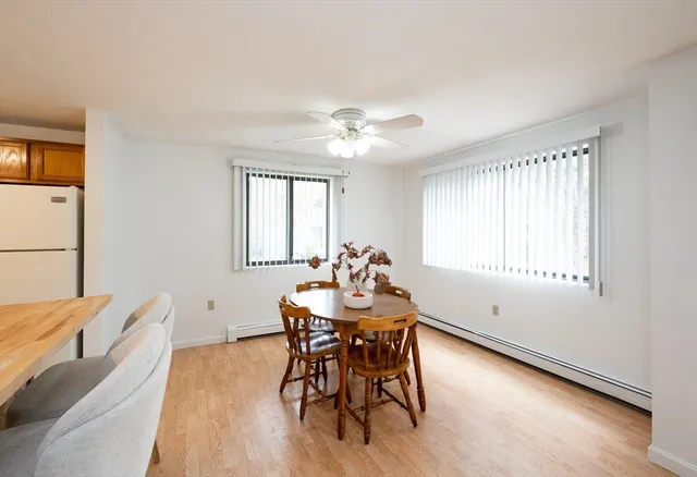 a dining room with furniture and window