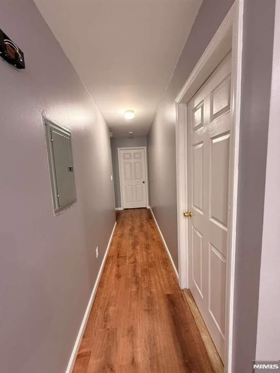 168 Grove Street Passaic, NJ 07055 - Photo 4 of 12 a view of a hallway with wooden floor