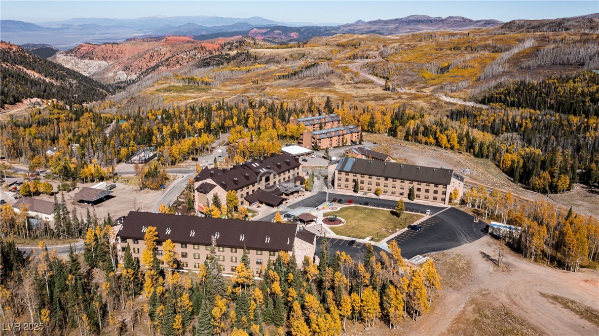 Aerial view of property's location with a mountain backdrop