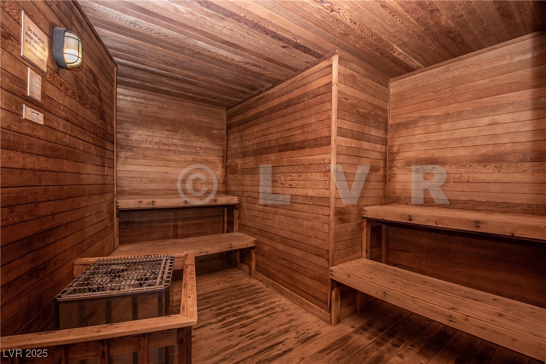 223 Hunter Ridge Drive, Unit 121 Brian Head, UT 84719 - Photo 18 of 35 Sauna / steam room with wooden ceiling, wooden walls, and hardwood / wood-style flooring