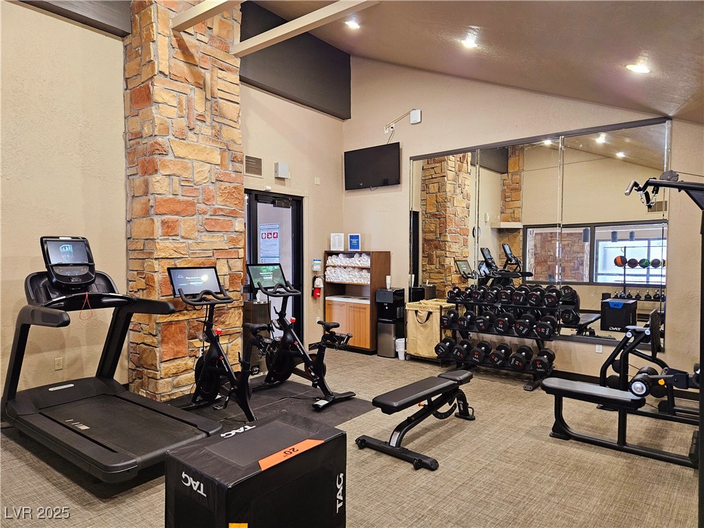 223 Hunter Ridge Drive, Unit 121 Brian Head, UT 84719 - Photo 20 of 35 Exercise room featuring carpet floors, high vaulted ceiling, and recessed lighting