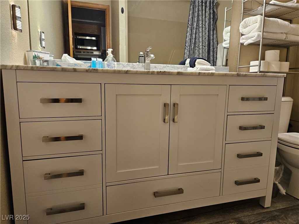 223 Hunter Ridge Drive, Unit 121 Brian Head, UT 84719 - Photo 8 of 35 Bathroom featuring vanity and wood finished floors