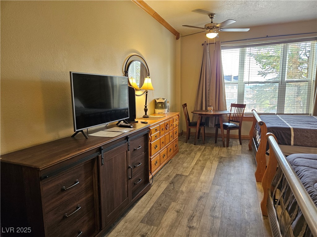 223 Hunter Ridge Drive, Unit 121 Brian Head, UT 84719 - Photo 10 of 35 Bedroom featuring light wood finished floors and ornamental molding