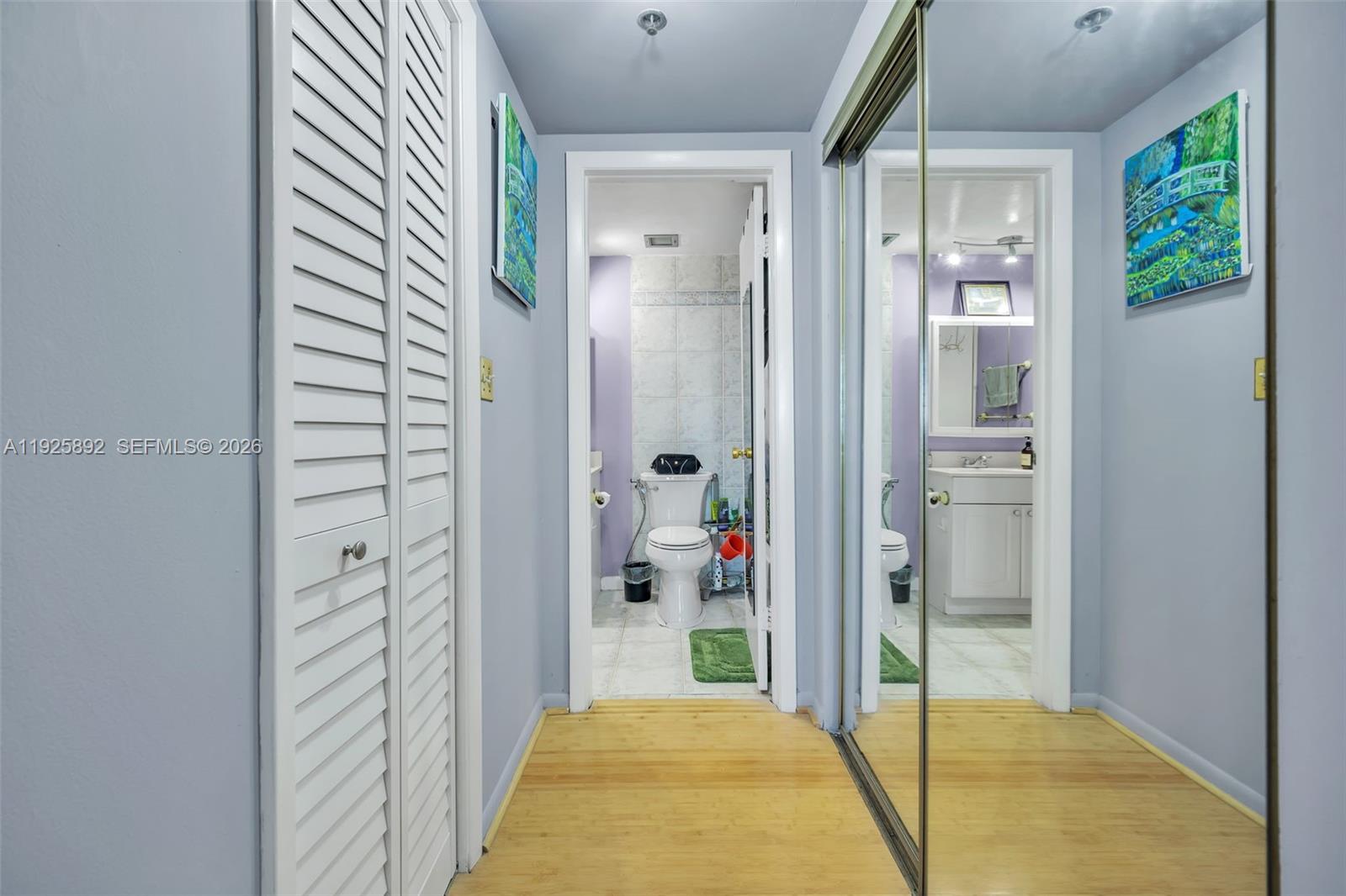 3850 Washington Street, Unit 409 Hollywood, FL 33021 - Photo 15 of 18 a view of a hallway with bathroom and glass door