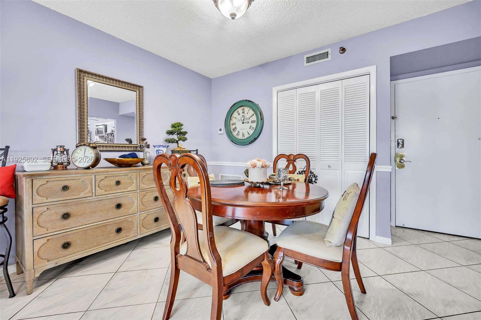 3850 Washington Street, Unit 409 Hollywood, FL 33021 - Photo 10 of 18 a dining room with furniture and window