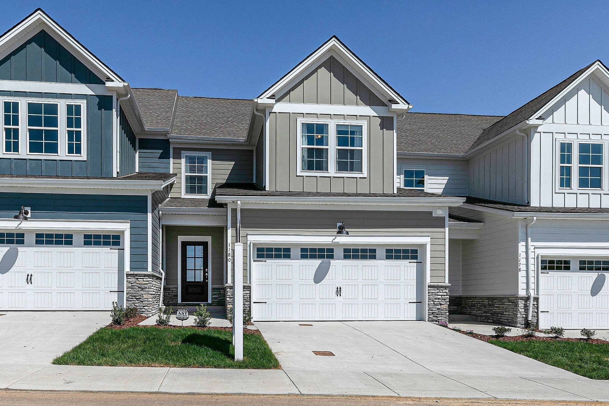1087 June Wilde Ridge Spring Hill, TN 37174 - Photo 1 of 19 a front view of a house with garden