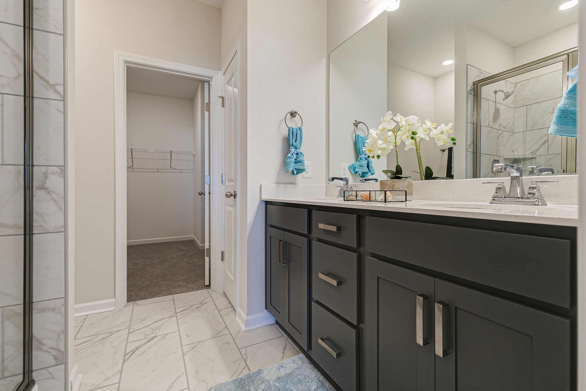 1087 June Wilde Ridge Spring Hill, TN 37174 - Photo 15 of 19 a bathroom with a sink a mirror and a shower