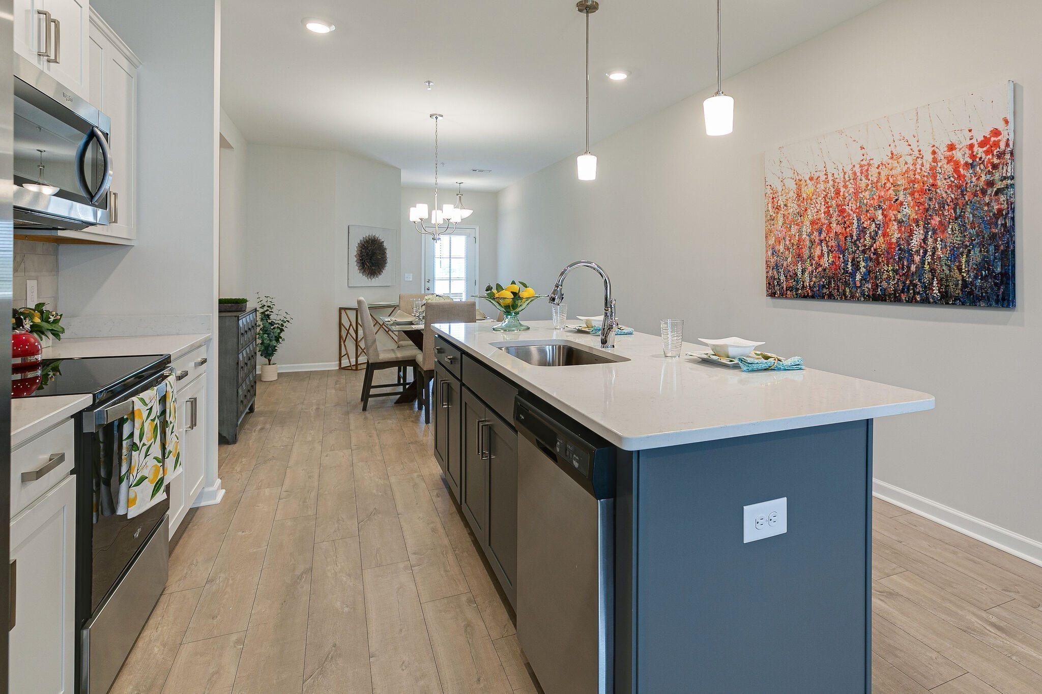 1087 June Wilde Ridge Spring Hill, TN 37174 - Photo 9 of 19 a kitchen with a sink and stove in it
