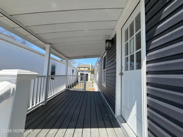 a view of balcony with wooden floor